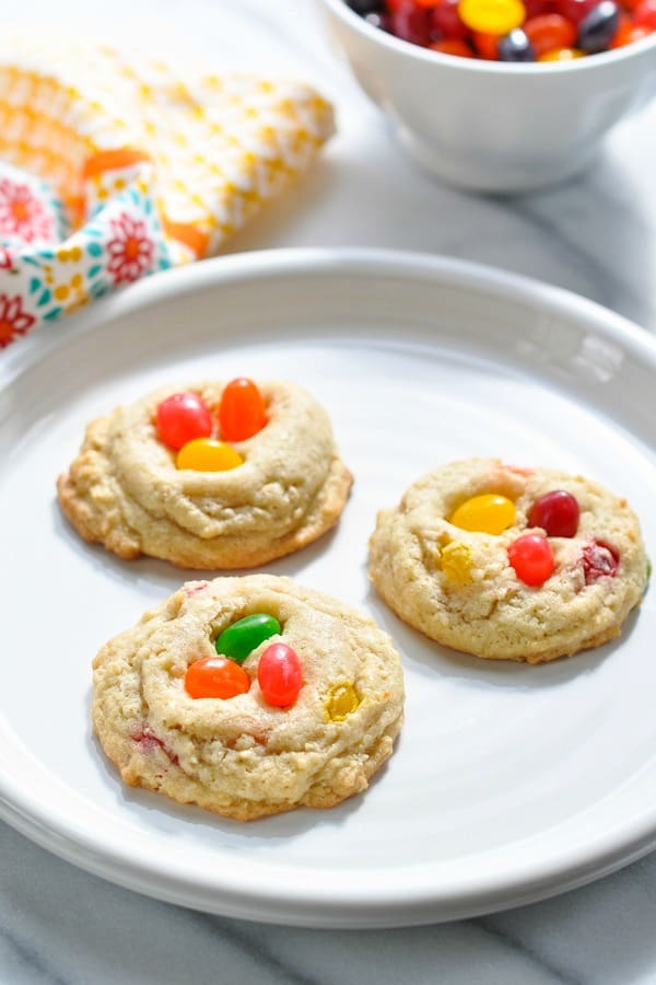 Three jelly bean cookies on a white plate