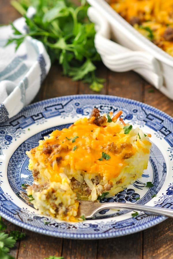 Image of a fork taking a bite of hash brown breakfast casserole with sausage