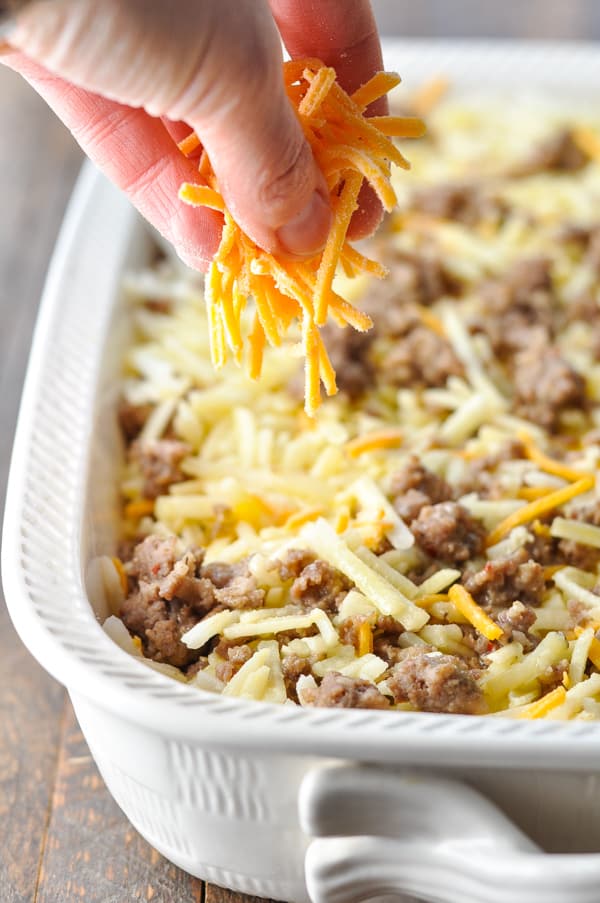 Sprinkling cheese on top of hash brown casserole