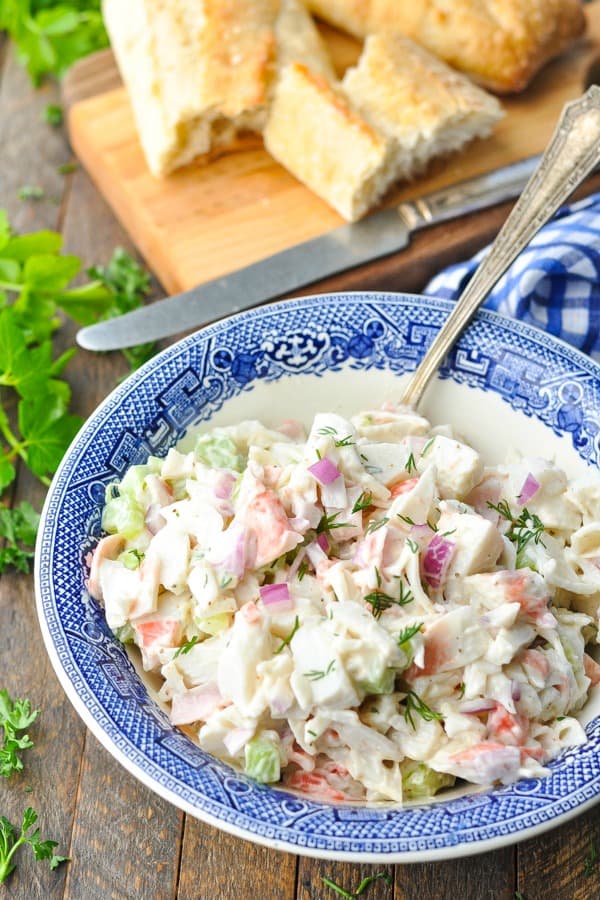 Side shot of seafood salad recipe in a blue and white bowl