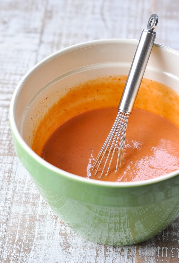 Bowl of tomato soup mixture for taco casserole