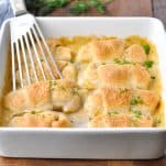 Horizontal shot of cheesy chicken crescent rolls in a white dish