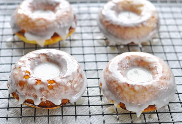 Glazed baked donuts on a wire rack