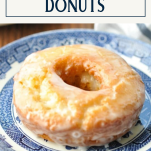 Side shot of old fashioned donut on a plate with text title box at top