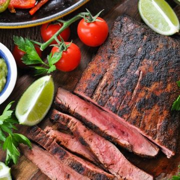 Close overhead shot of sliced steak fajitas recipe on a cutting board