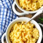 Close overhead image of two white bowls of easy stovetop mac and cheese recipe
