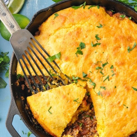 Close overhead shot of tamale pie in a cast iron skillet