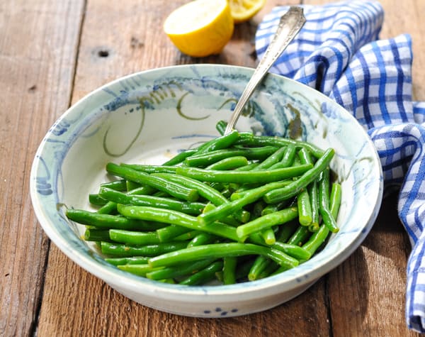 Horizontal shot of a bowl of amish green beans with brown butter