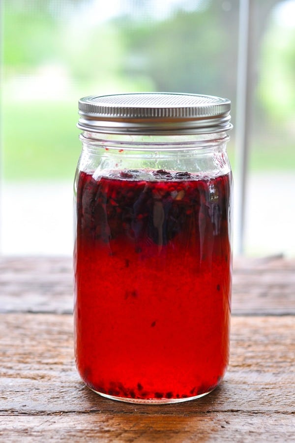 Mason jar full of blackberry juice