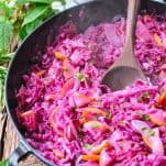 Close up front shot of a skillet of braised red cabbage