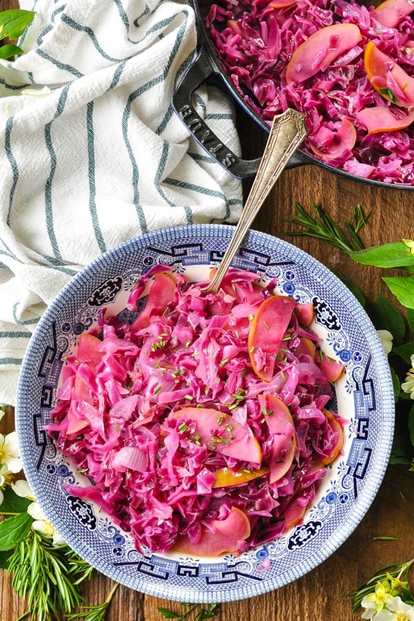 German braised red cabbage in a blue and white bowl on a wooden table