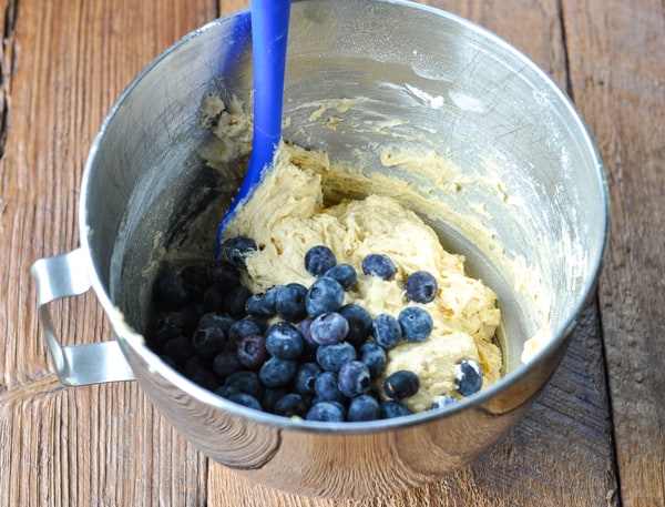 Folding blueberries into muffin batter
