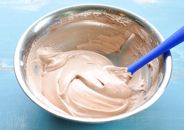 Easy chocolate frosting made with Cool Whip in a metal mixing bowl
