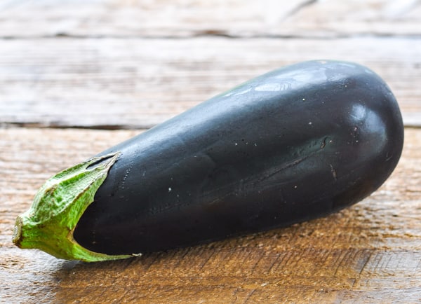 Fresh eggplant on a wooden table
