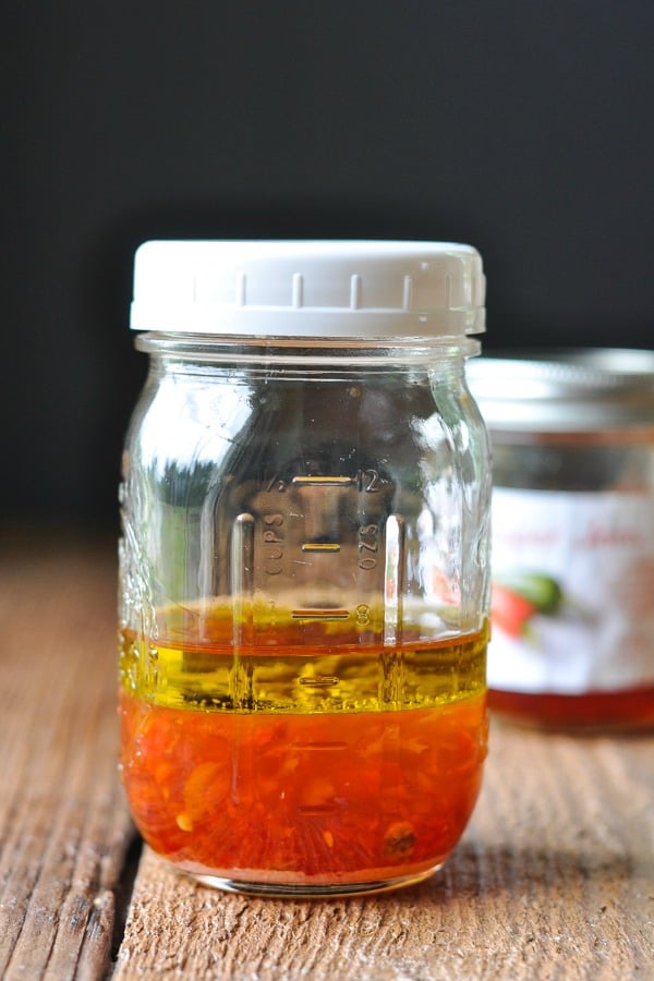 Ingredients for Pepper Jelly Vinaigrette in a mason jar