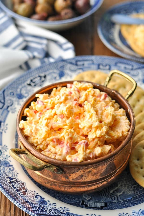 Homemade pimento cheese without cream cheese served in a bowl with crackers on the side