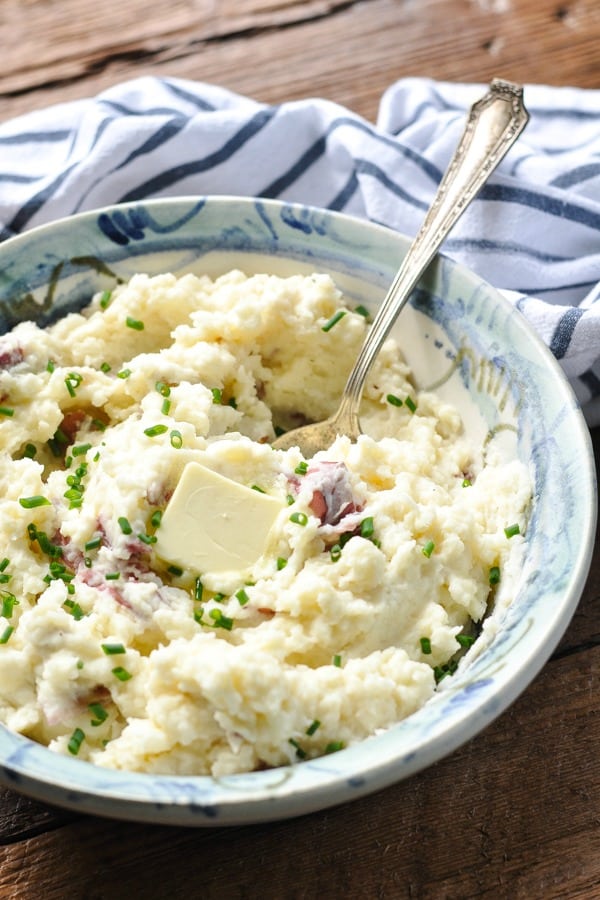 Front shot of a bowl of creamy skin on mashed red potatoes