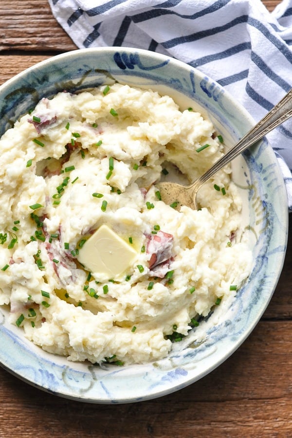 Overhead shot of a bowl of homemade mashed potatoes with skin