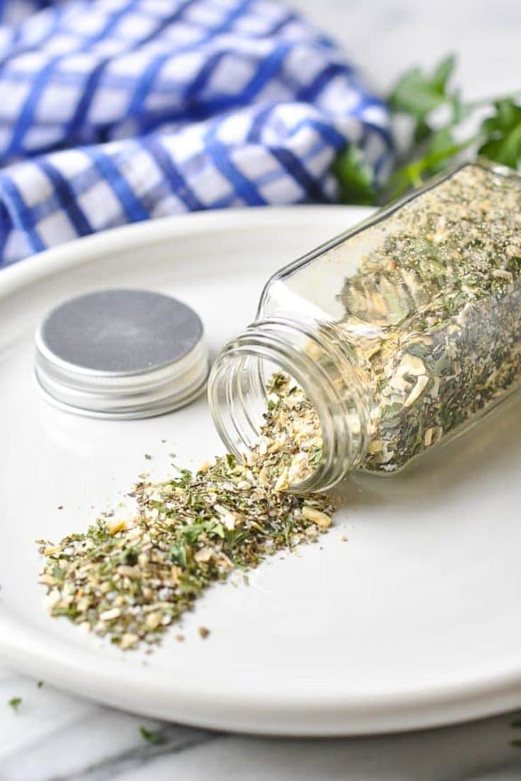 Pork chop seasoning for grilled pork chops on a white plate.