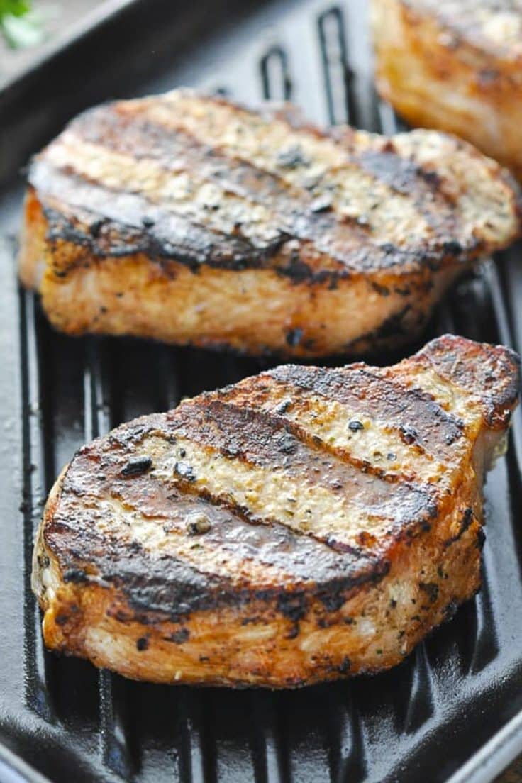 Side shot of one of the best grilled pork chop recipes on a grill pan.