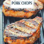 Close up side shot of pork chops on the grill with text title overlay