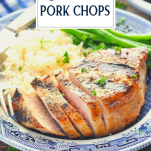 Side shot of a plate of sliced grilled pork chops with text title overlay