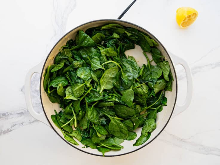 Sauteed spinach after removing the lid.