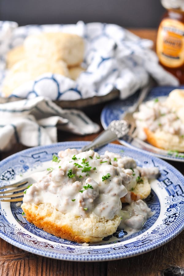 A homemade buttermilk biscuit smothered in creamy sausage country gravy