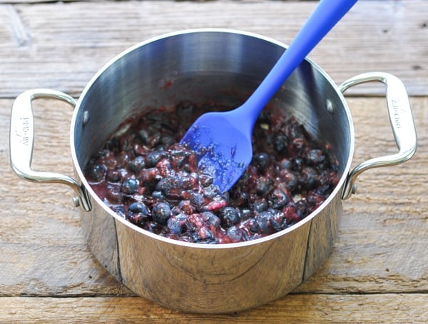 Blueberries and lemon juice in a saucepan