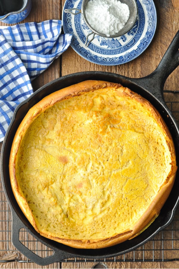 Overhead shot of a Dutch Baby Pancake on a wooden table