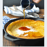 Photo of a Dutch Baby Pancake with a text title below the image