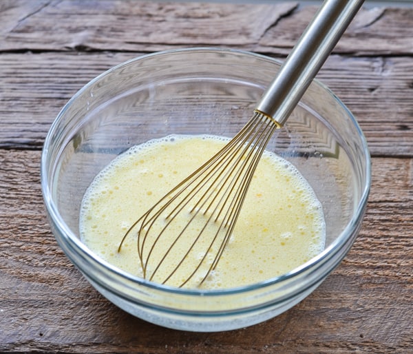 Whisking wet ingredients for buttermilk pancakes