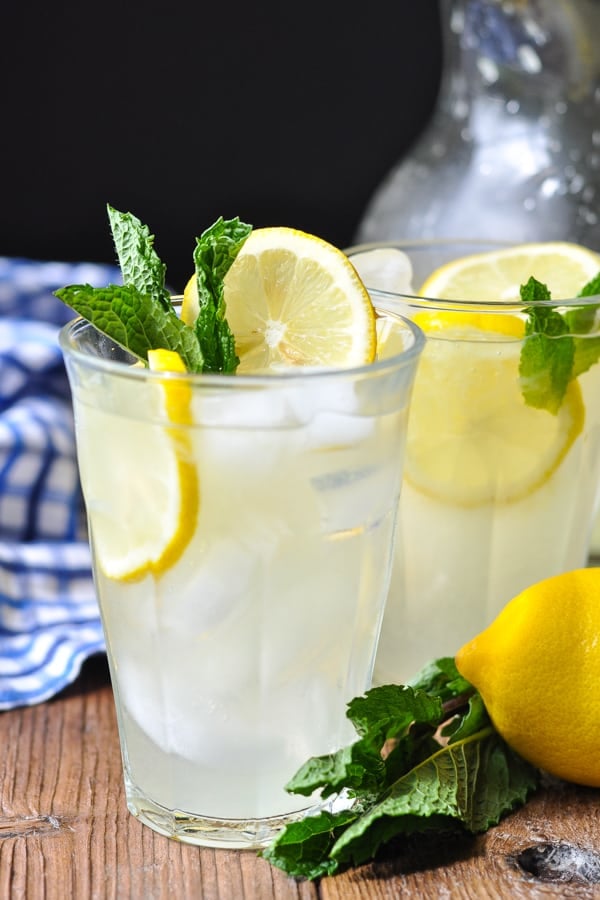 Two glasses of homemade lemonade garnished with fresh mint