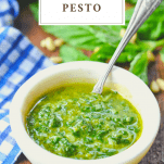 Bowl of homemade pesto with a text title on top