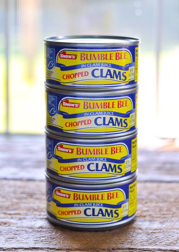 Four cans of chopped clams in a stack