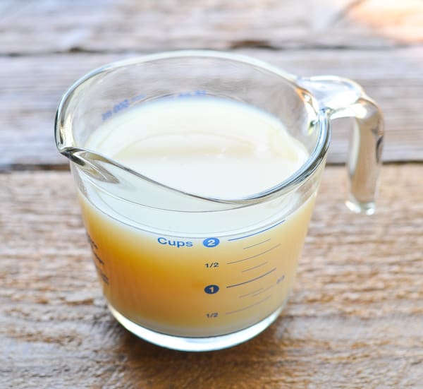 Clam juice in a measuring cup
