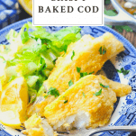 Crispy baked cod on a blue and white plate with salad and a text title at the top