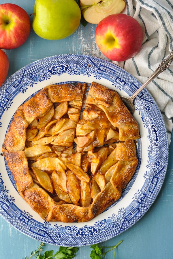 Overhead image of a slice being cut from an easy apple galette