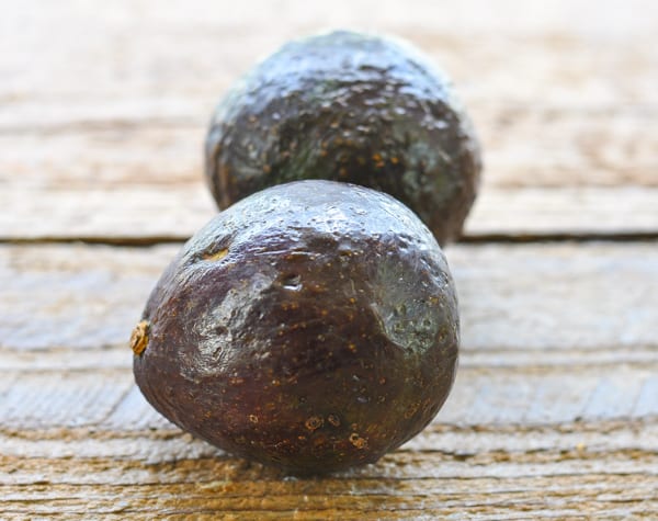 Haas avocados on a wooden table