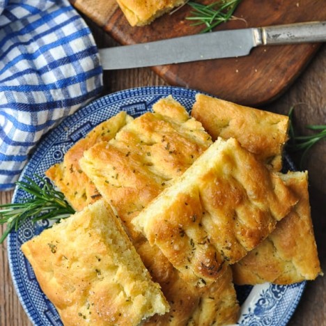 Plate of focaccia bread garnished with fresh rosemary