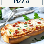 Side shot of a plate of french bread pizza with text title box at top