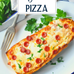 French bread pizza homemade on a white plate with text title overlay