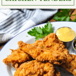 Fried chicken tenders on a white platter with a text title box at the top