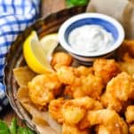 The best fried shrimp recipe served on a tray with lemon and tartar sauce