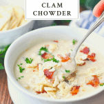 Spoon in a bowl of New England Clam Chowder with text title at top