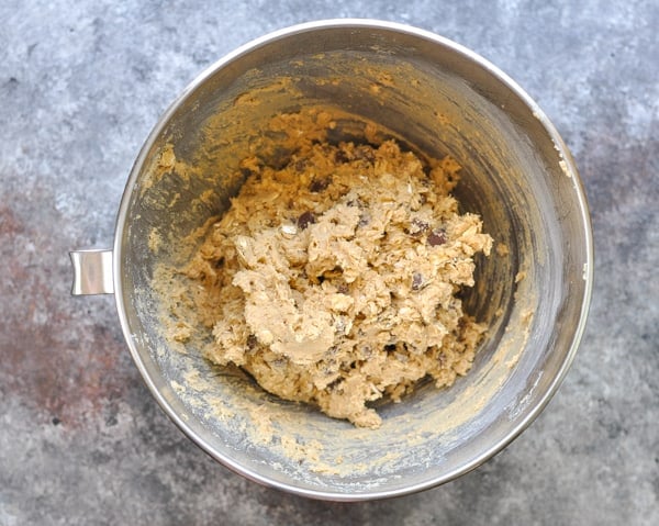 Overhead shot of oatmeal chocolate chip cookie dough in a mixing bowl
