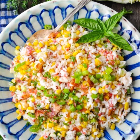 Close overhead shot of summer rice salad with fresh corn and bacon