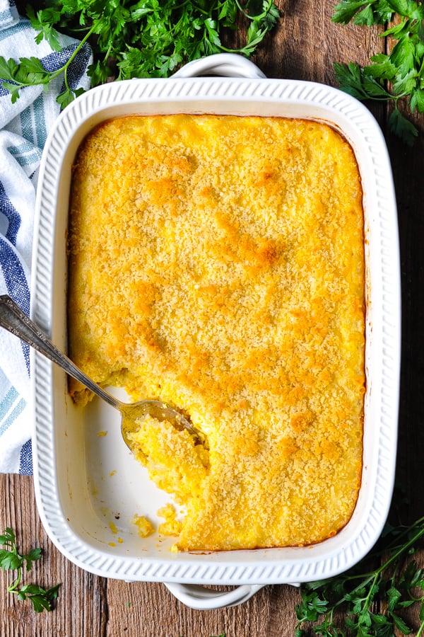 Overhead image of a white casserole dish full of baked macaroni and cheese