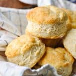 Close up side shot of a basket of homemade biscuits
