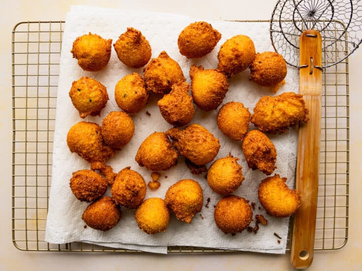 Hush puppies draining on paper towels.